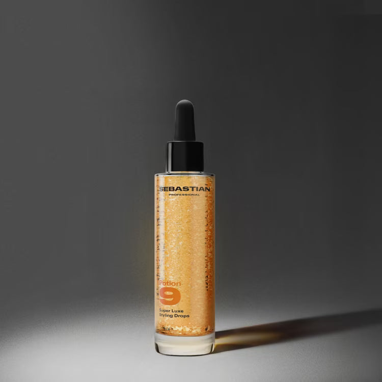 Sebastian hair product bottle with dropper on a dark background