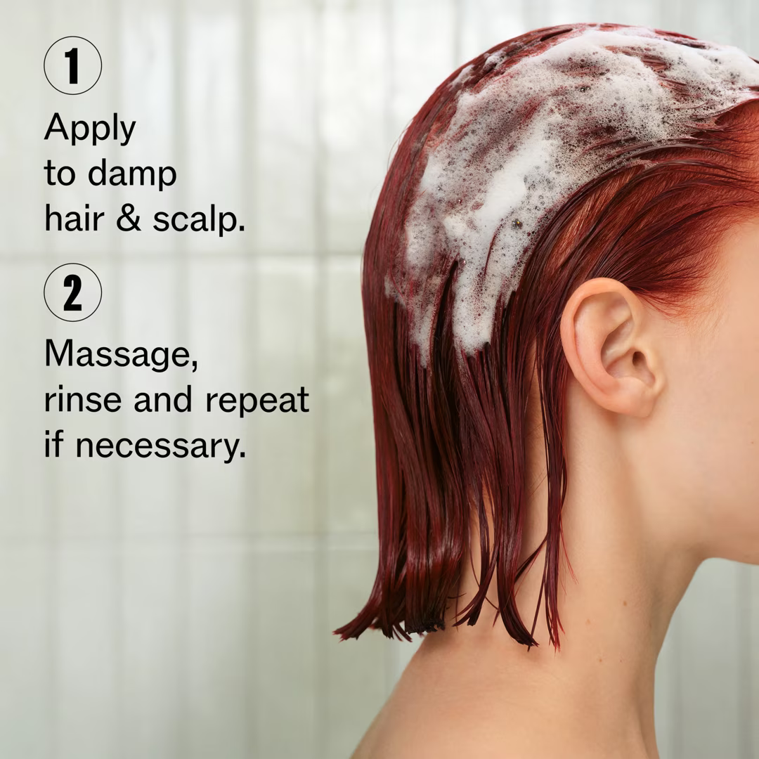 Person with red hair applying shampoo to scalp with text instructions.