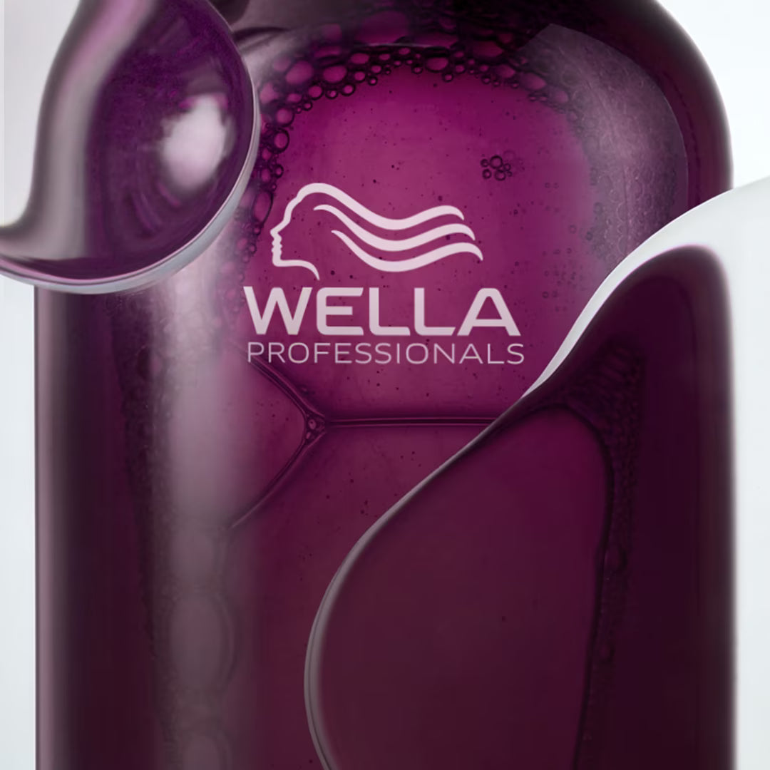 Close-up of a Wella Professionals product with a focus on the brand logo.