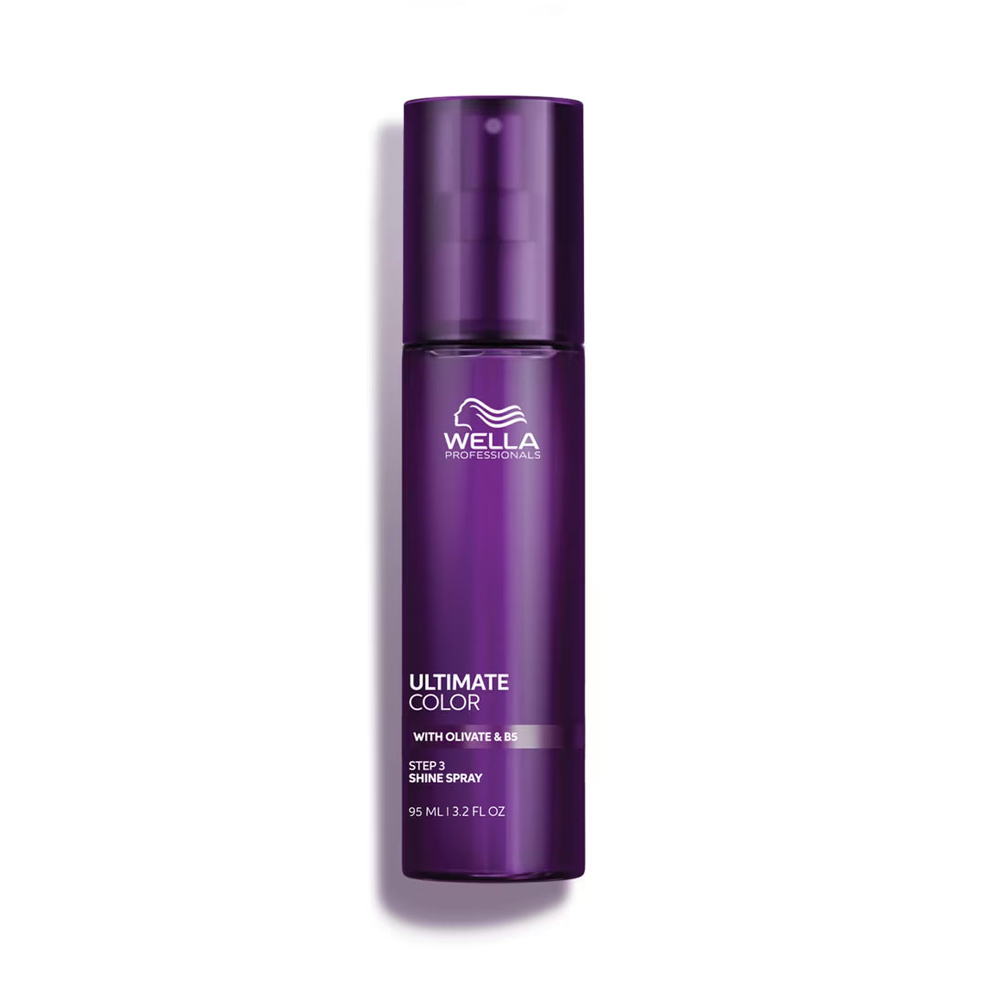Purple Wella spray bottle on a white background
