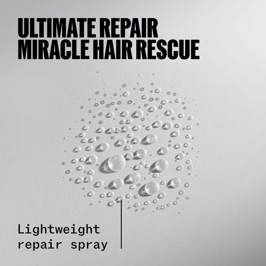 Advertisement for 'Ultimate Repair Miracle Hair Rescue' hair spray with water droplets on a gray background.