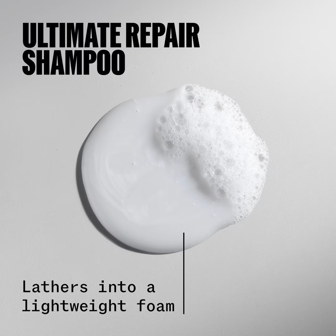 Shampoo bar with foam and text 'Ultimate Repair Shampoo' on a gray background