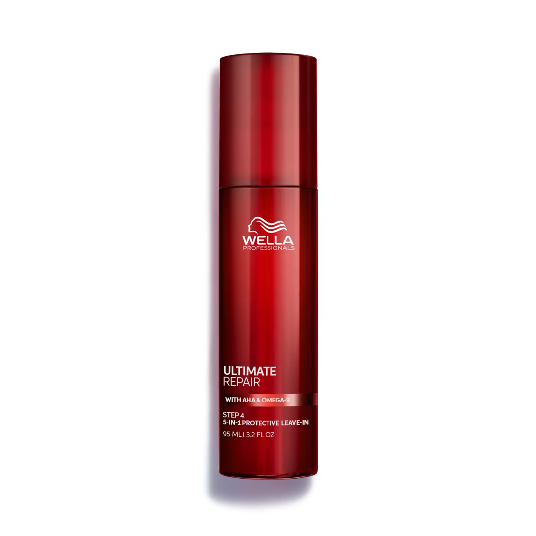 Red bottle of Wella Ultimate Repair hair product on a white background