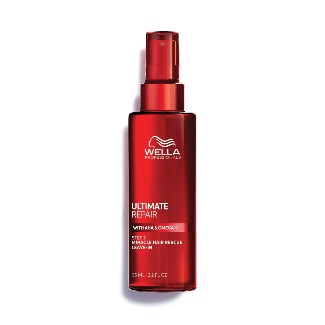 Red bottle of Wella Ultimate Repair hair product on a white background
