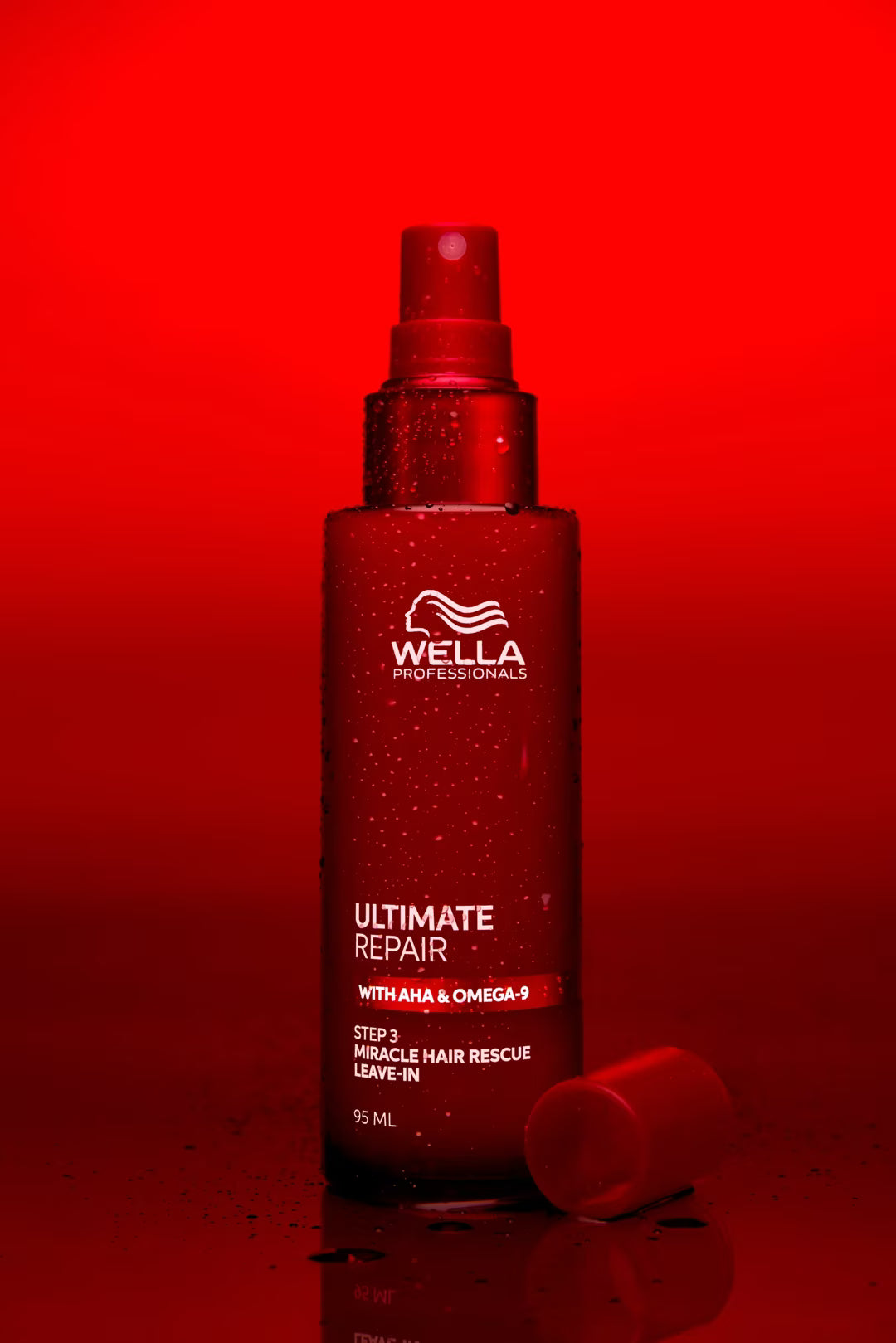 Wella spray bottle on a red background