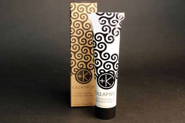 A tube and box of Cult and King CREAM POP Conditioning Cleanser for Hair, with black swirl patterns in black and tan, shown on a dark background—ideal for cleansing hair while maintaining natural oils and shine.