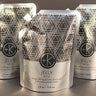 Three silver pouches labeled "Cult and King JELLY | Pink Himalayan Salt Infusion for Hair, 4 fl oz / 118 mL" are arranged on a dark background, promising to enhance volume and texture.