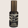 A dark bottle of "Cult and King PUMPABLE HAIR POWDER" showcases white abstract patterns against a sleek black backdrop. This talc-free, antioxidant-rich formula is boosted with Kaolin clay to ensure refreshed, revitalized hair without the added weight.