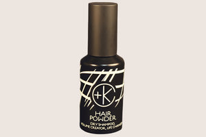 A black bottle labeled "Cult and King PUMPABLE HAIR POWDER | Dry Shampoo, Volume Creator, Life Changer" stands upright against a plain background, highlighting the antioxidant-rich powder from Cult and King.