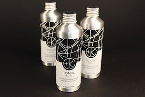 Three metallic bottles of Cult and King TONIK | Conditioning Hair & Scalp Potion, each 6 fl oz (177 mL), with black and white geometric designs, stand on a dark surface.