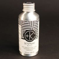 A metallic bottle labeled "Cult and King SETSPRAY Refill" with a black and white geometric design contains Semi-Precious Tri-Phase Wonderworking Hairspray infused with Malachite Extract. The bottle volume is 4 fl oz (118 ml).