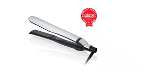 The GHD PLATINUM+ STYLER - 1" FLAT IRON by GHD, shown in black and white, appears next to a red Allure Best of Beauty Hall of Fame award badge and features Ultra-zone™ predictive technology for flawless styling.