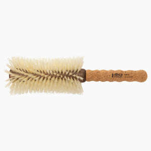 Round brush with cork handle on a white background