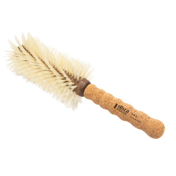 Cork brush with bristles on a white background