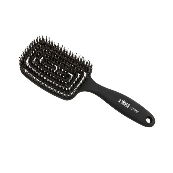 Black hairbrush with bristle head on a white background