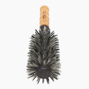 Round hairbrush with cork handle on a white background