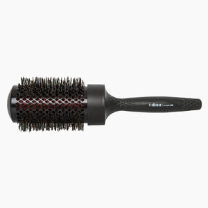 Black round hairbrush with bristle head on a white background