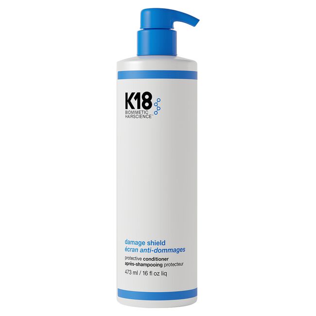 K18 hair care product bottle with blue pump on a white background