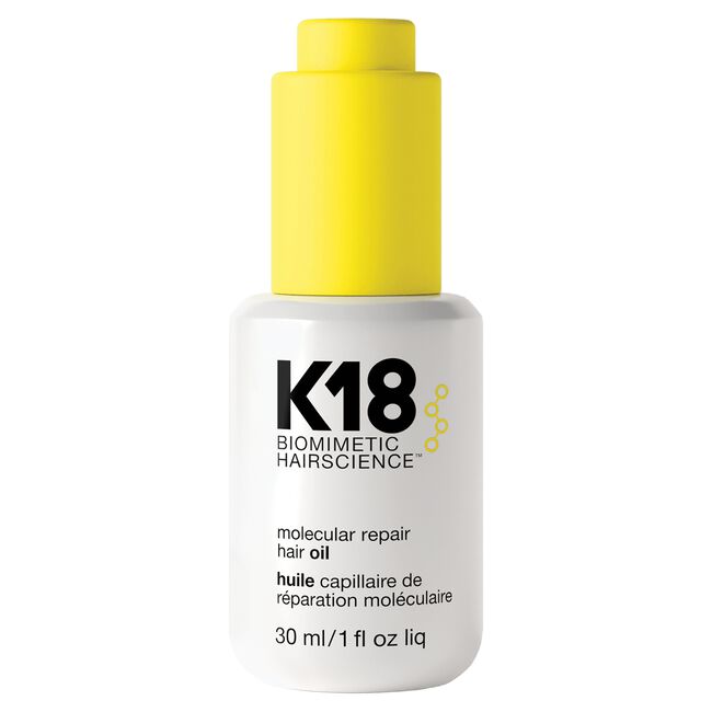 K18 biomimetic hairscience molecular repair hair oil bottle with yellow cap on a white background