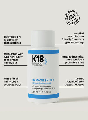 A white bottle from the K18 Shield + Smooth Routine Set by K18 Hair Repair is shown, highlighting features like vegan, microbiome-friendly, frizz control, hair protection, and suitability for all hair types.