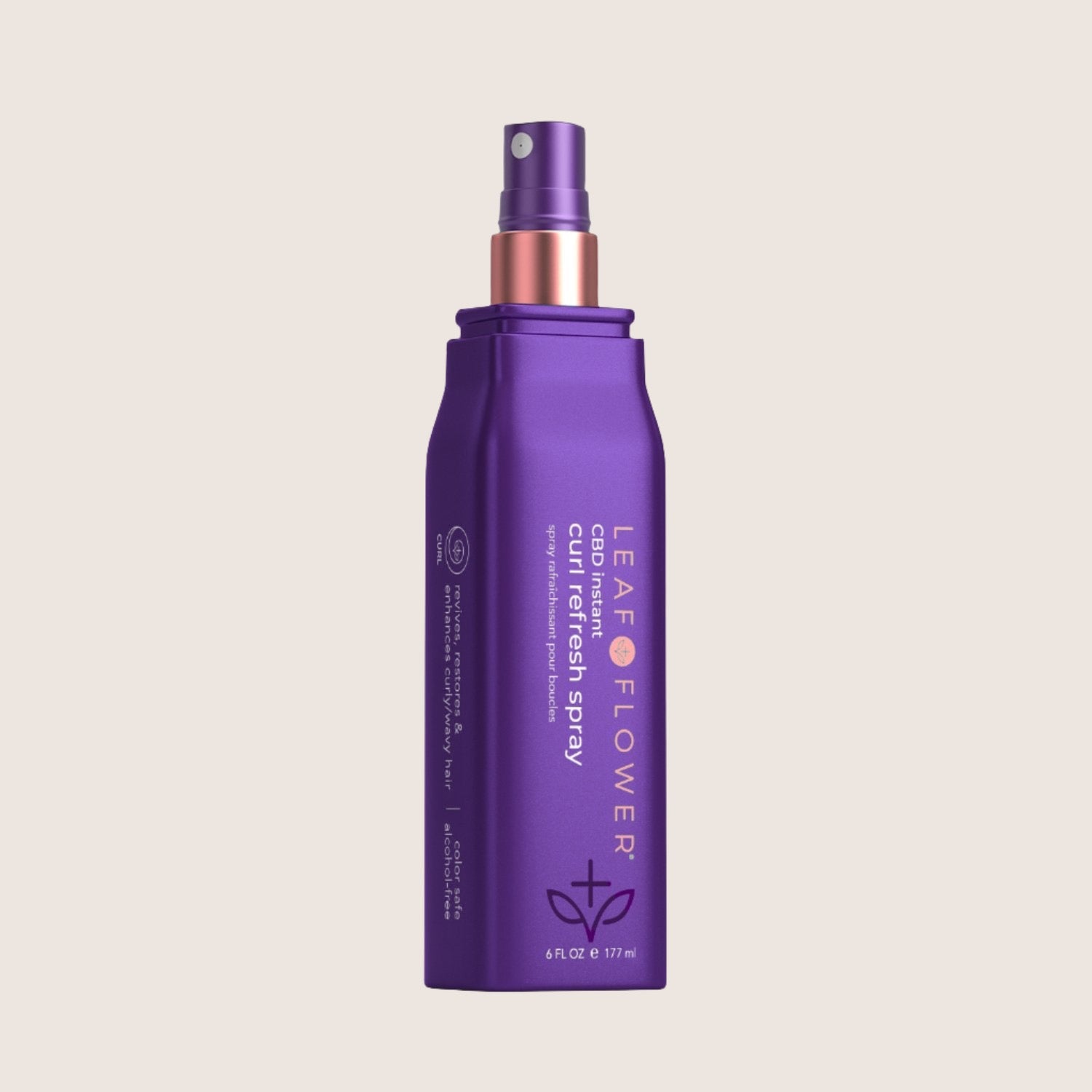 A vegan-friendly purple spray bottle, Leaf and Flower Instant Curl Refresh Spray, features a convenient nozzle for reviving curls. It serves as an effective curl activator for lasting bounce and shine.