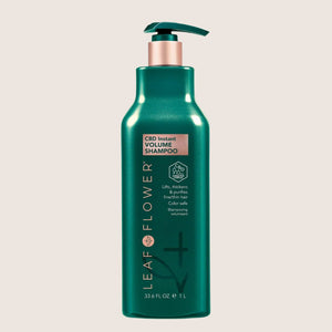 A 1-liter green bottle of LEAF and FLOWER Instant Volume Shampoo with a pump. Sulfate-free, plant-based formula thickens, purifies, and volumizes fine or limp hair while being color-safe. Multiple sizes available.