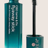 A teal bottle of Leaf and Flower Tame & Fix Flyaway Stick with its black mascara-like applicator exposed. The front label featuring product information and brand logo highlights its plant-based CBD Corrective Complex for effective frizz control.
