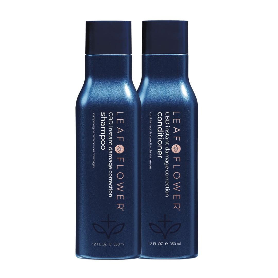 Two blue 12 fl oz bottles of Leaf and Flower Instant Damage Correction Shampoo & Conditioner Duo stand side by side on a white background, featuring the Leaf and Flower brand and designed for effective damage correction.