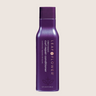 A purple bottle of Leaf and Flower Instant Curl Repair Conditioner for all curl types.