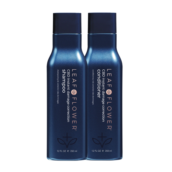 Two blue 12 fl oz bottles of Leaf and Flower Instant Damage Correction Shampoo & Conditioner Duo stand side by side on a white background, featuring the Leaf and Flower brand and designed for effective damage correction.