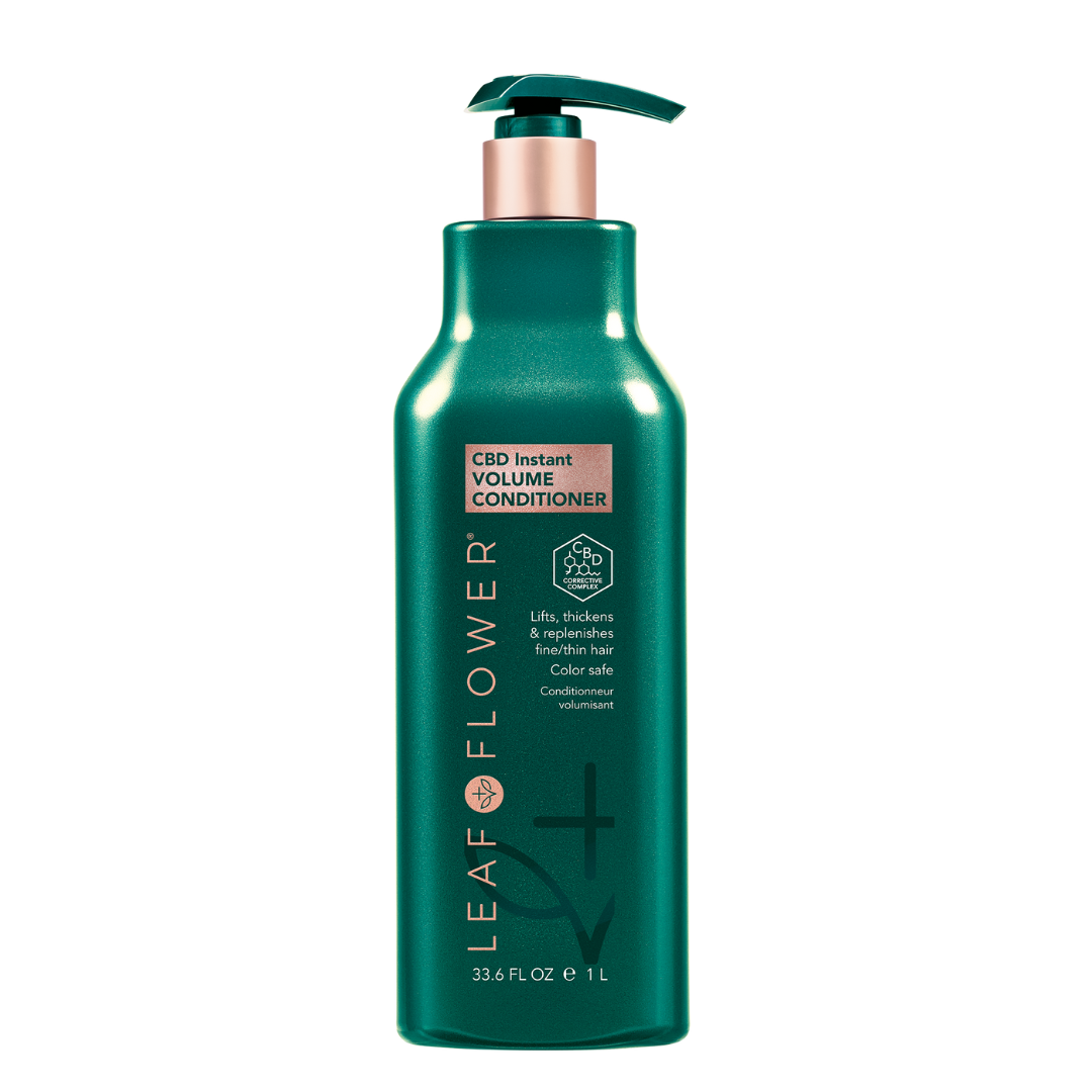 A bottle of green Leaf and Flower haircare shampoo.