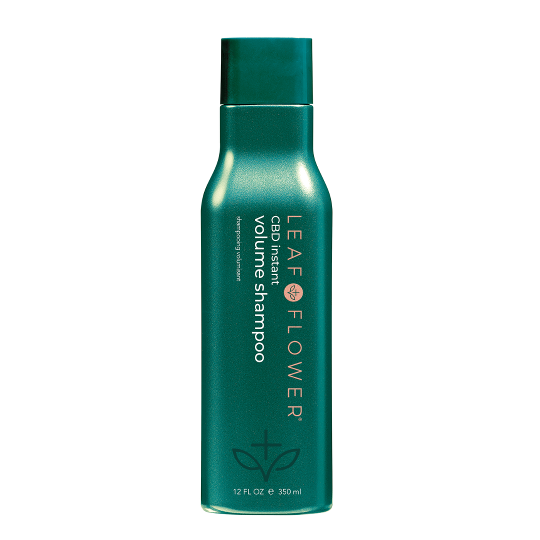 A bottle of Leaf and Flower Instant Volume Shampoo cleanses and adds volume.