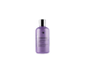 A bottle of Oligo Blacklight Nourishing Conditioner for color-treated hair.