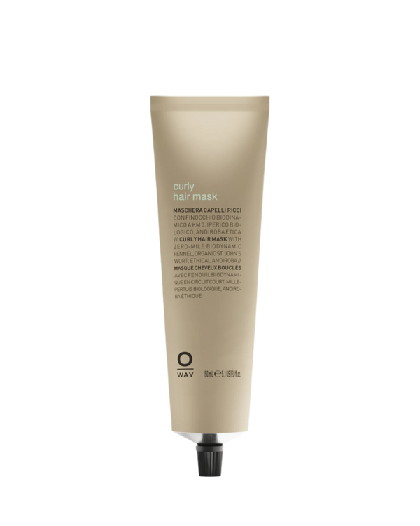 A beige tube of Oway Curly Hair Mask | Definition and Moisture Mask for Natural Curls stands upright on a white background, with a black screw cap and multilingual text. Ideal for delivering deep moisture to natural curls.