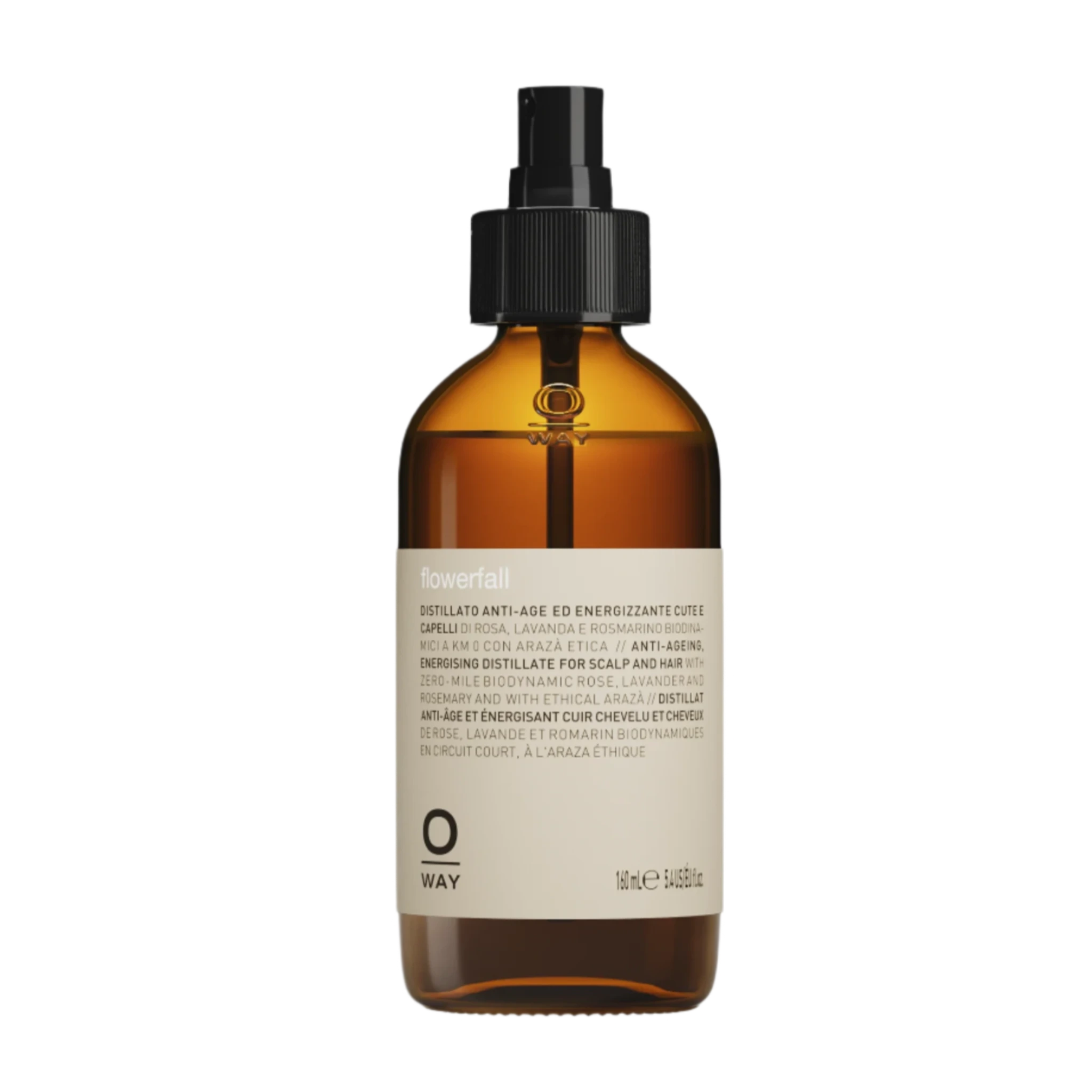 A brown glass spray bottle with a black nozzle and beige label displays "Oway Flowerfall | Aromatherapeutic Scalp and Mind Balancing Mist" by Oway, designed for holistic scalp care.