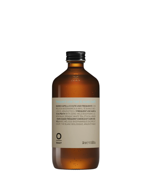 Oway Frequent Use Hair & Scalp Bath is a gentle daily shampoo for all hair types. Presented in a 240 ml (8.5 fl oz) brown glass bottle with a silver screw cap, the label features product info in multiple languages.