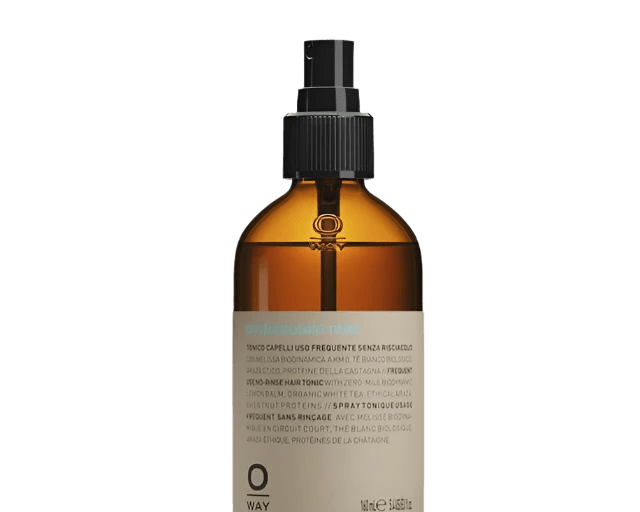 A brown glass spray bottle with a black nozzle and beige label containing Oway Phytoprotein Mist, a leave-in treatment to strengthen fragile hair and prevent breakage.