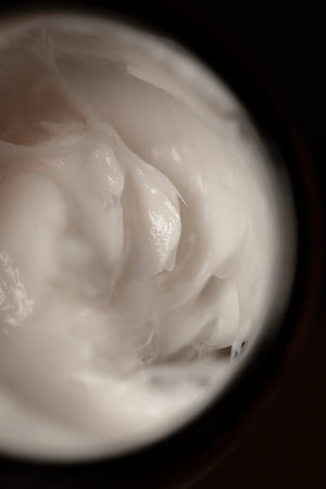 Close-up of Oway Shaping Putty by Oway, a thick, white styling putty with a smooth, glossy texture—ideal for medium hold and flexible re-styling for sculpted texture.