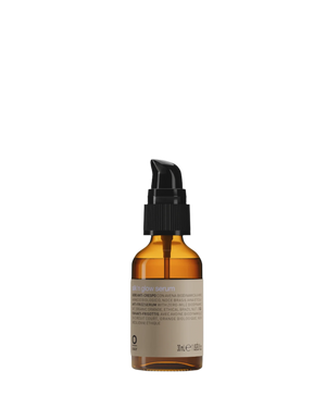 A 30 ml (1 fl. oz.) brown glass dropper bottle with a black pump cap, labeled "Oway Silk’N Glow Serum | Anti-Frizz Shine Serum for Dry, Frizzy Hair" by Oway, highlights Brazil nut oil as an ingredient against a plain white background.