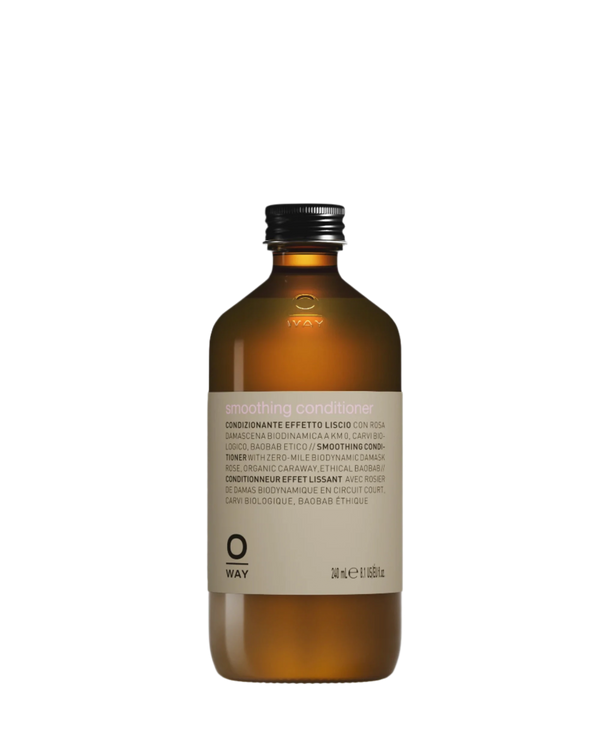 A 240 ml brown glass bottle of Oway Smoothing Conditioner by Oway, with a silver cap and white bilingual label. Infused with biodynamic caraway, it detangles and smooths hair for a soft, polished finish.