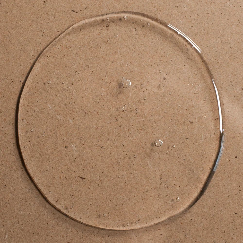 Clear circular object on a brown cardboard background
