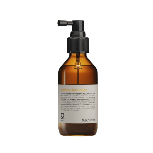 Brown glass bottle with black pump on a white background