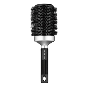 The RUSK Round Brush is a round black brush with a ceramic barrel, metal accents, and a ribbed handle with a hole for hanging.
