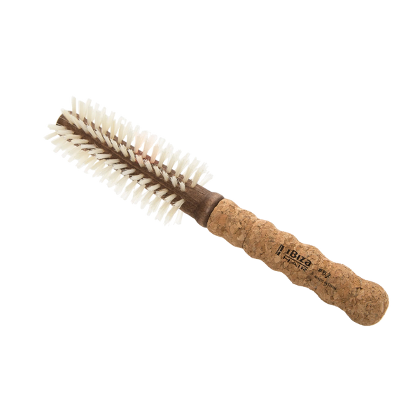 Round brush with cork handle on a white background