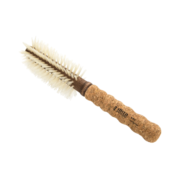Round brush with cork handle on a white background