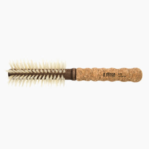 Round hairbrush with cork handle on a white background