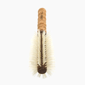 Bottle brush with cork handle on a white background