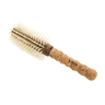 Round brush with cork handle on a white background