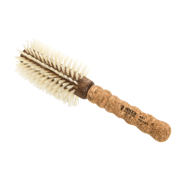 Round brush with cork handle on a white background