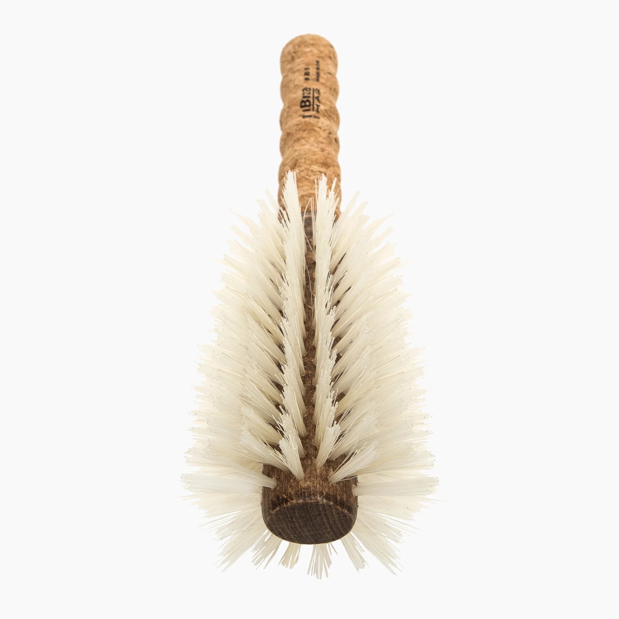 Bristle brush with cork handle on a white background